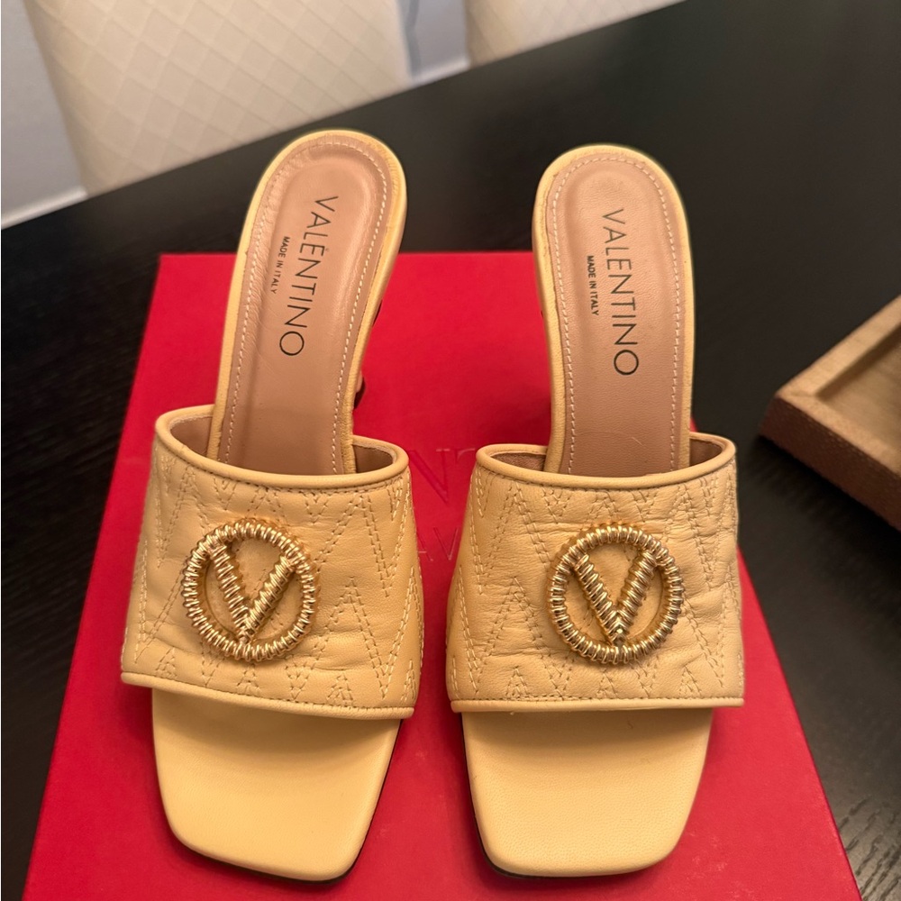 Valentino Cream Quilted Mules with Gold Emblem